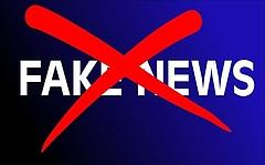 auf blauem Hintergrund stehen in weißer Schrift die Wörter Fake News. Sie sind mit einem roten Kreuz durchstrichen